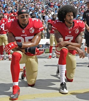 Colin Kaepernick takes a knee